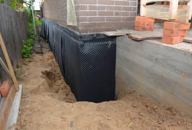 Happy homeowners after waterproofing job in Broomall